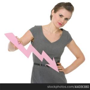 Serious business woman holding decreasing chart arrow . HQ photo. Not oversharpened. Not oversaturated. Serious business woman holding decreasing chart arrow isolated