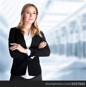 Serious business woman in the office, modern building of great corporate, successful career, smart girl working in luxury business center