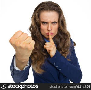 Serious business woman threatening with fist