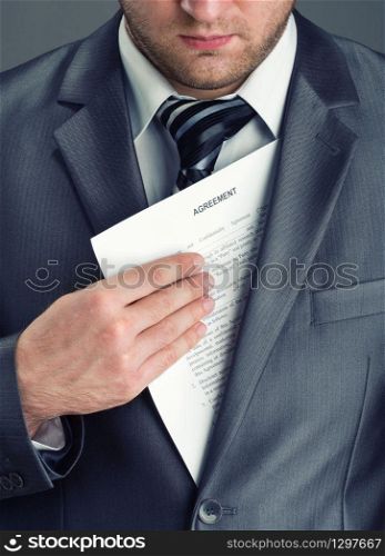 Serious businessman getting agreement from suit