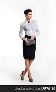 Serious businesswoman accountant - fashion model with notepad