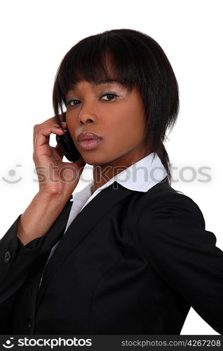 Serious businesswoman with a phone