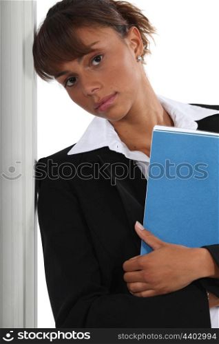 Serious businesswoman with file