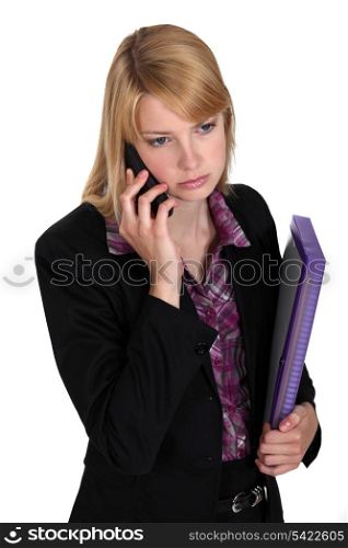 Serious businesswoman with files