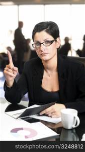 Serious businesswomen warns you with her index-finger.