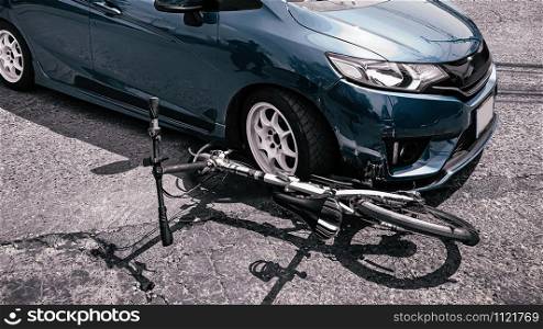 Serious Car accident. Car hit and ran over bicycle on street. Car insurance collision concept