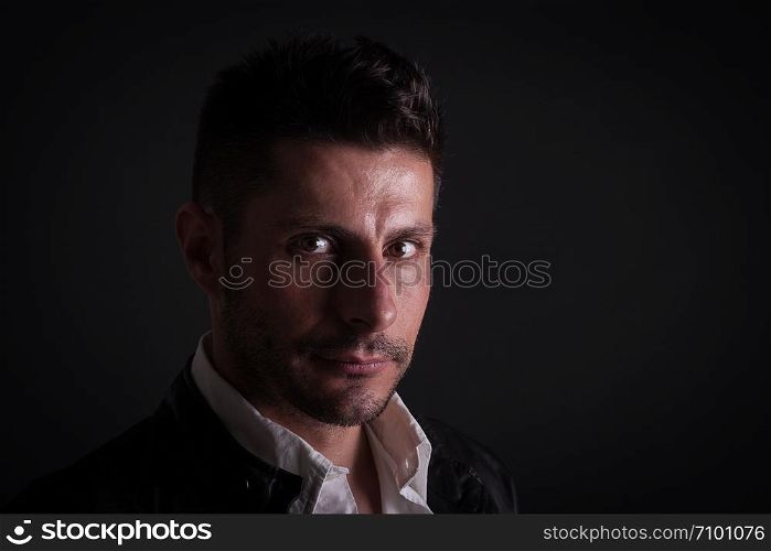 serious caucasian man on dark background