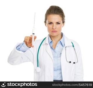 Serious doctor woman with syringe