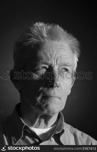 Serious elderly man. Portrait taken in the studio