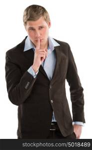 Serious executive standing with finger near his mouth - tss gesture