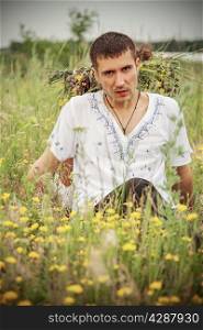 serious guy in a meadow