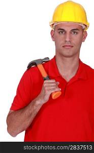 Serious handyman holding hammer