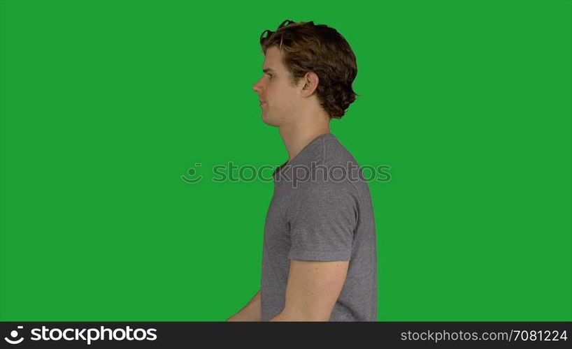 Serious looking man in grey t-shirt (Green Key)