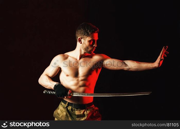 serious man in military style with weapon