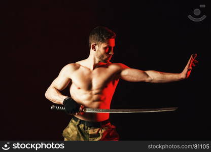 serious man in military style with weapon