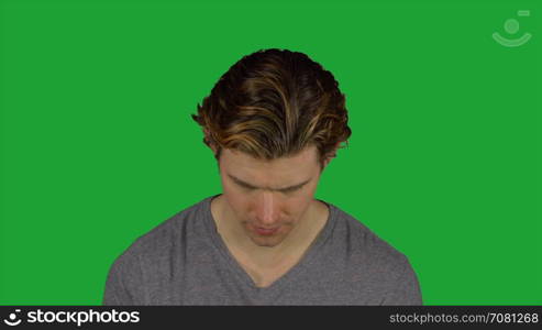 Serious man lifts up head (Green Key)