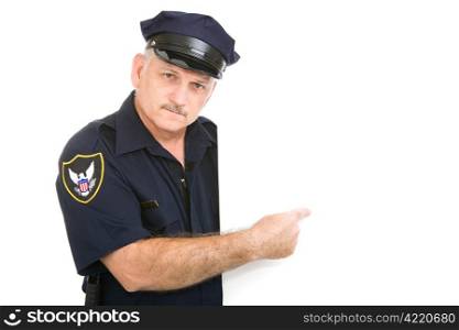 Serious, mature police officer pointing at blank white space. Insert your sign.