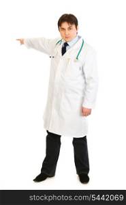 Serious medical doctor pointing finger at something isolated on white&#xA;