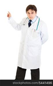 Serious medical doctor pointing finger in corner isolated on white&#xA;