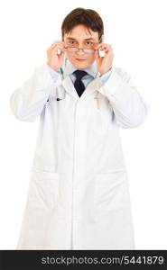 Serious medical doctor wearing eyeglasses isolated on white&#xA;