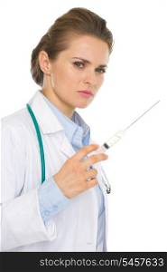 Serious medical doctor woman with syringe