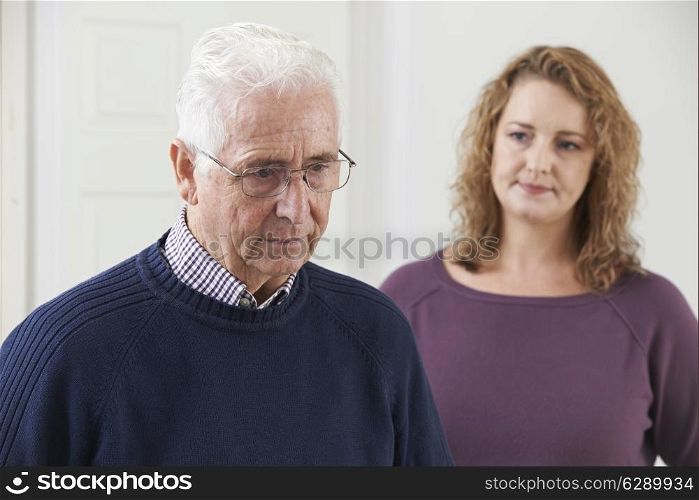 Serious Senior Man With Adult Daughter At Home