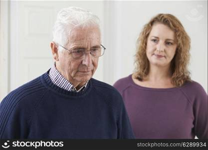 Serious Senior Man With Adult Daughter At Home