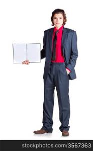 Serious student stands with notebook in gray suit and red shirt on white background