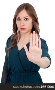 Serious woman asking to stop with the focus on the hand isolated on a white background