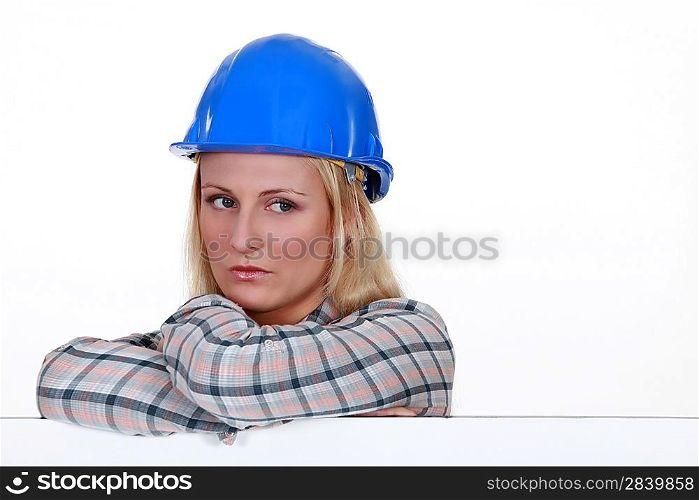 Serious woman in a hard hat