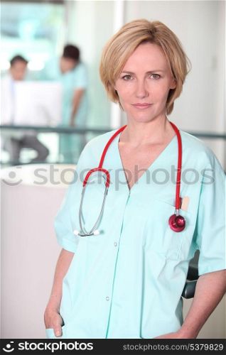Serious woman in scrubs