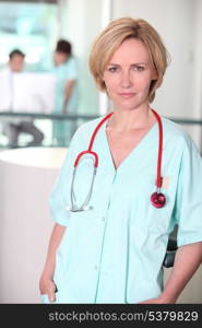 Serious woman in scrubs