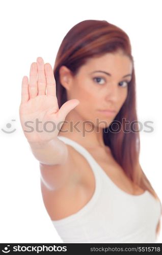 Serious woman making a stop sign with her hand isolated on a white background