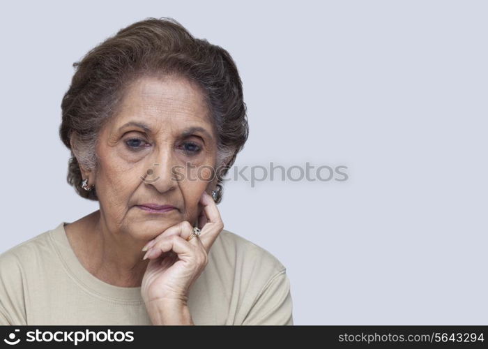 Serious woman thinking over white background