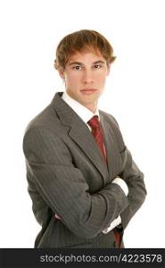 Serious young businessman with arms crossed on a white background.