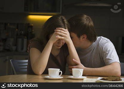 Serious young couple woman with head in hands
