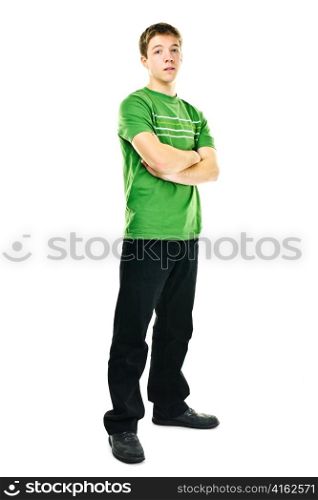 Serious young man standing full body with arms crossed isolated on white background