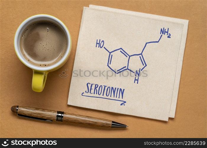 serotonin molecule chemical structure, one of brain happiness chemicals - rough sketch on a napkin with a cup of coffee, chemistry and physiology concept