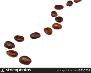 serpentine line pattern from roasted coffee beans with focus foreground