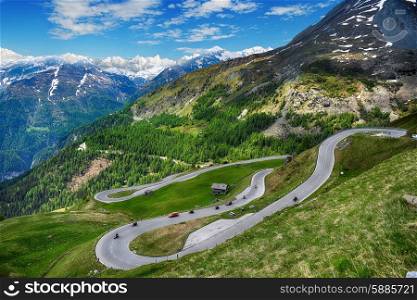 serpentine mountain road winds through valley