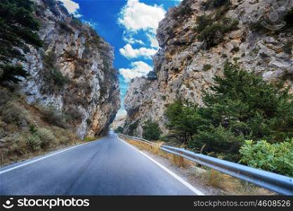serpentine road winds through mountain