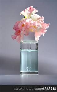 Serum with a dropper with spring beautiful flowers.. Serum with a dropper with spring flowers.