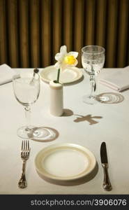 served table in restaurant with flower