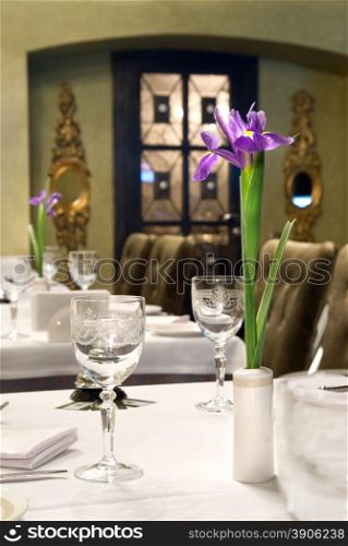 served table in restaurant with flower