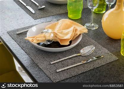 served with a plate on the table in yellow and grey colors decoration