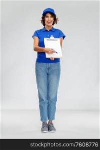 service and people concept - happy smiling delivery woman in blue uniform with clipboard over grey background. happy smiling delivery woman with clipboard