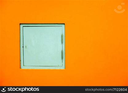 Service doors of the building ,walls painted orange color