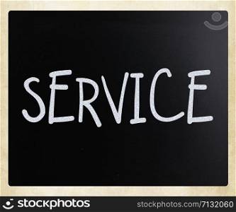 ""Service" handwritten with white chalk on a blackboard"