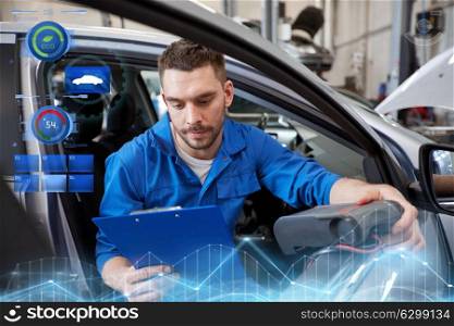 service, repair, maintenance and people concept - mechanic man with automotive diagnostic scanner and clipboard checking car system at workshop. mechanic man with diagnostic scanner at car shop
