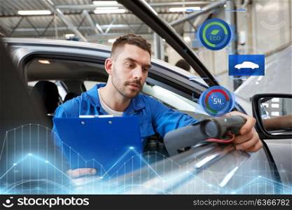 service, repair, maintenance and people concept - mechanic man with automotive diagnostic scanner and clipboard checking car system at workshop. mechanic man with diagnostic scanner at car shop